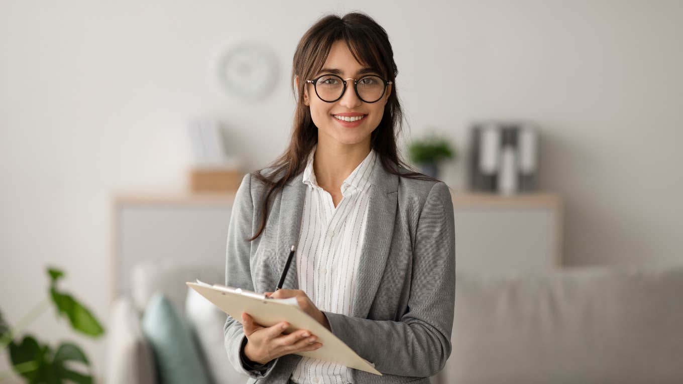 Professional woman holding clipboard