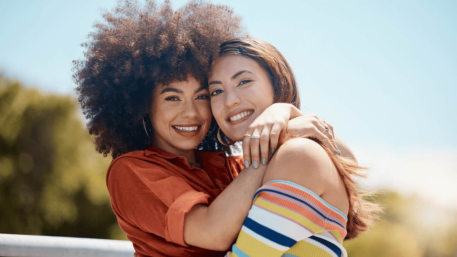 friends hugging and smiling