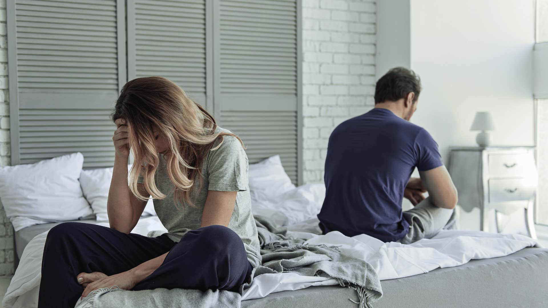 couple not facing each other on bed