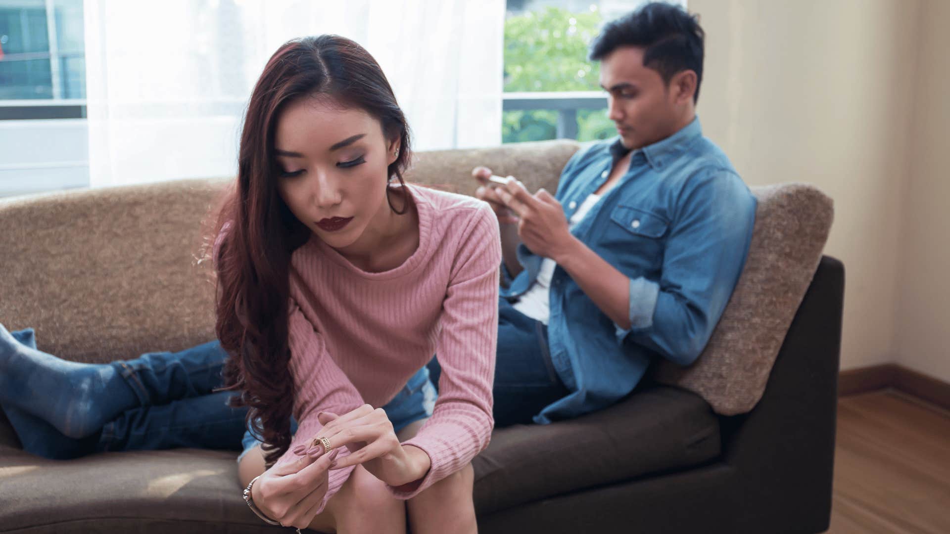 woman fidgeting with fingernails