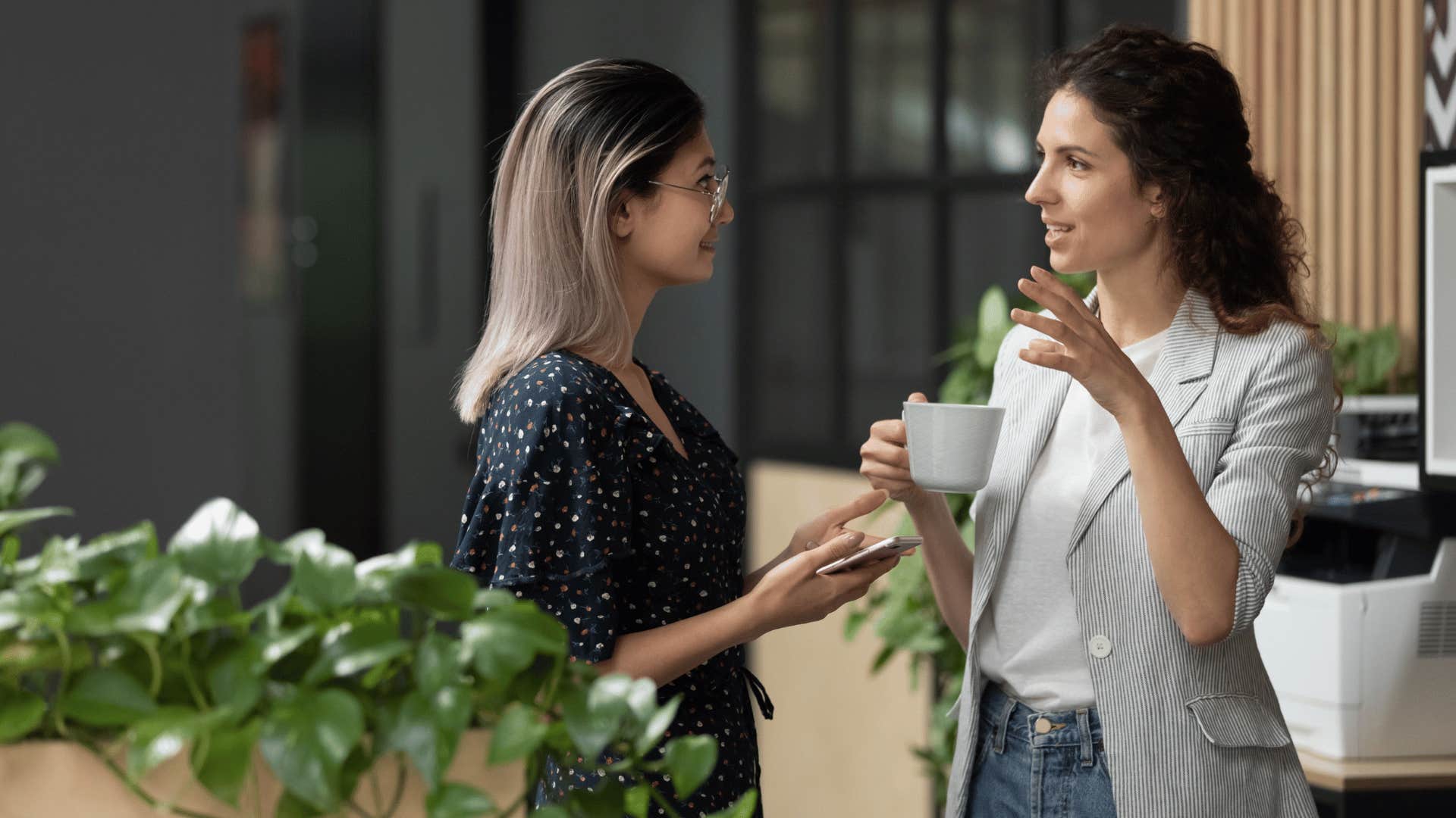 woman interrupting coworker talking