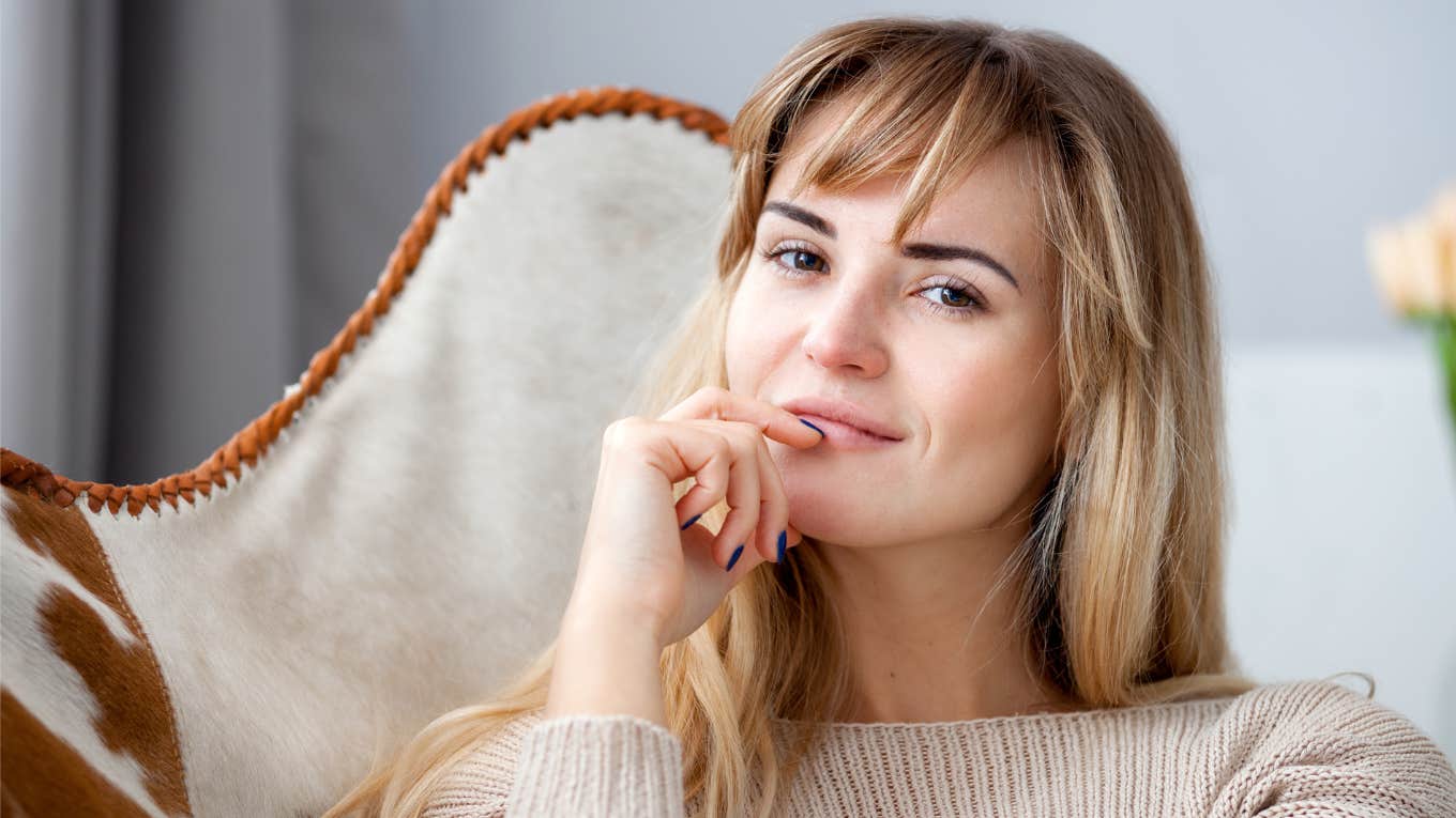 intelligent woman sitting on couch