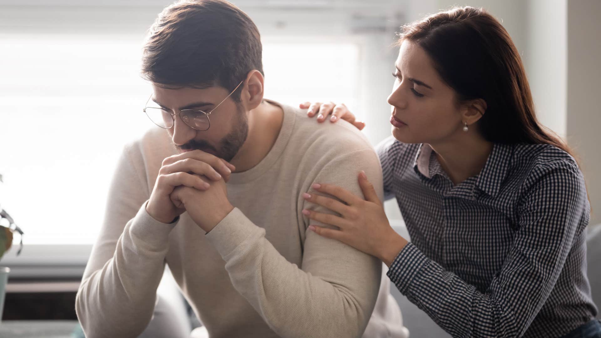 wife comforting husband after apologizing