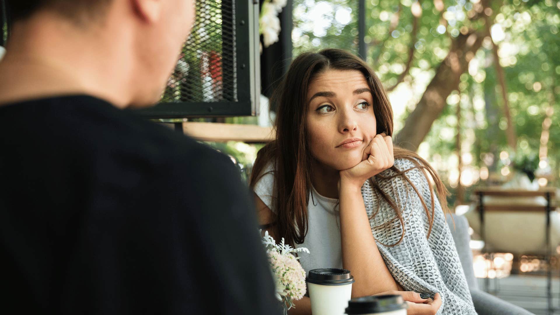 woman avoiding eye contact with man