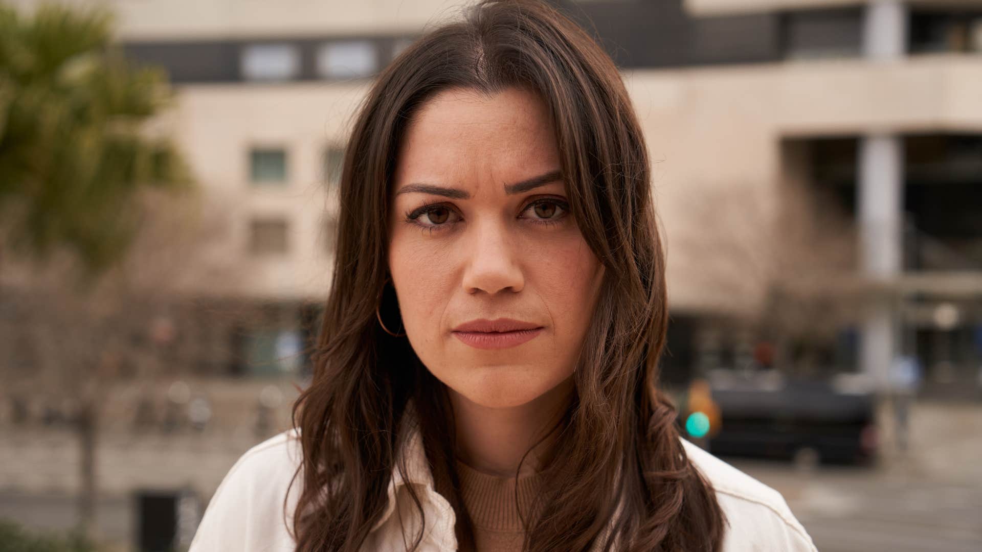 serious young woman looking overwhelmed