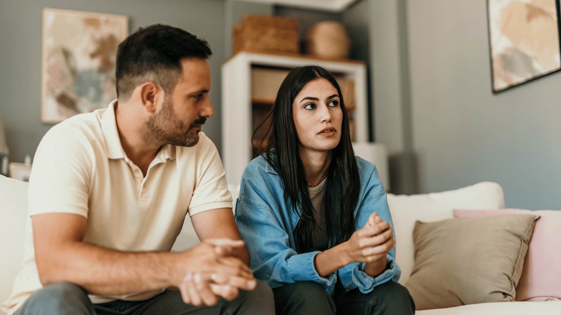 woman reluctantly agreeing with man