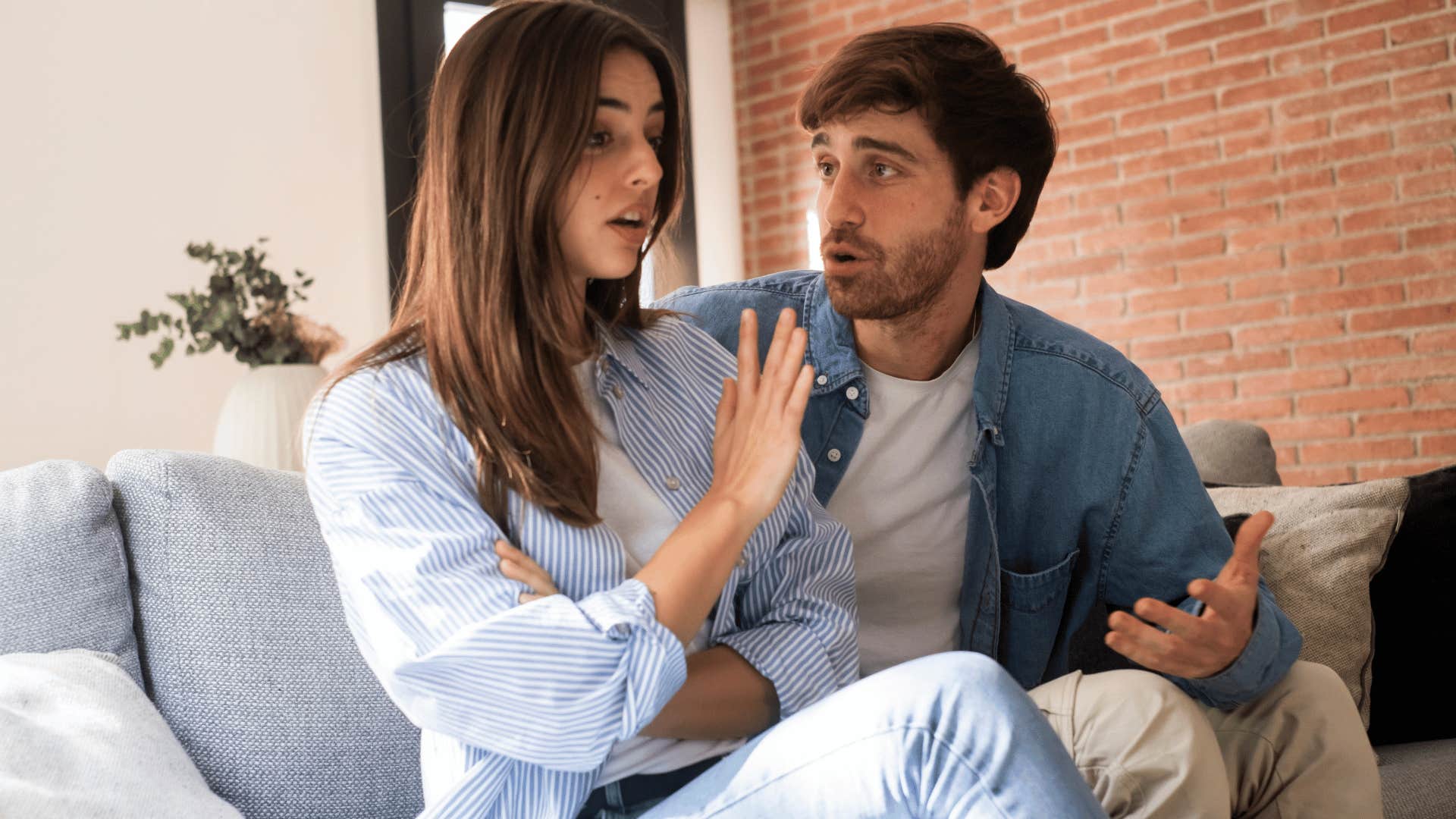 couple arguing on couch