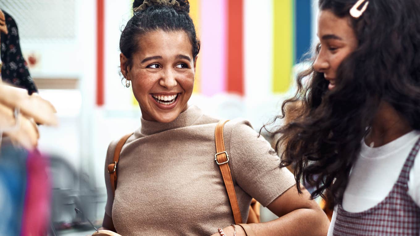 Young women siblings shopping together as best friends 