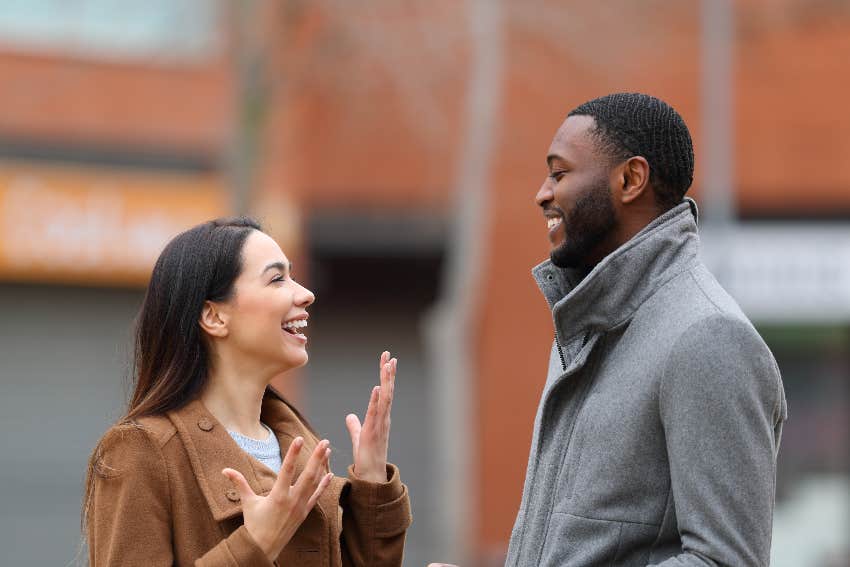 man and woman facing each other and talking