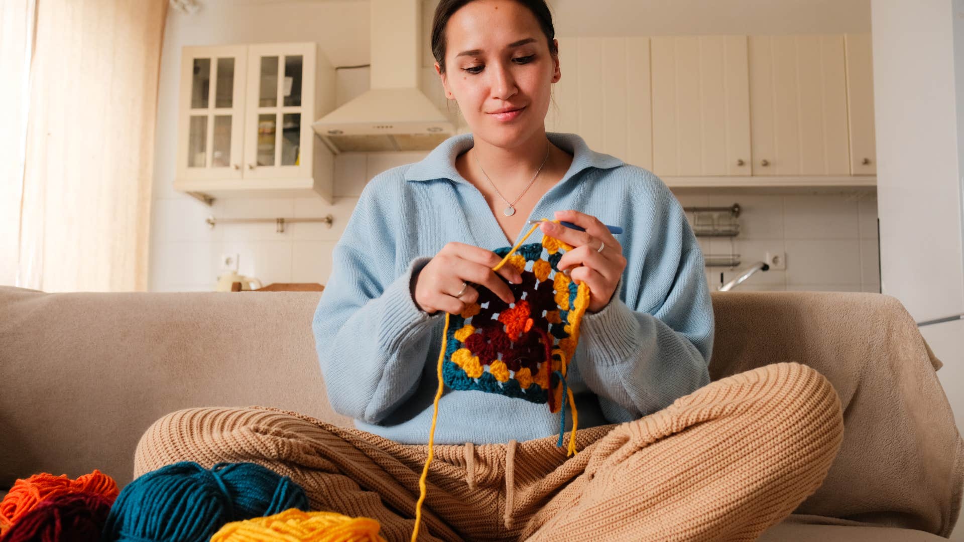 Gen Z woman crocheting boomer hobby