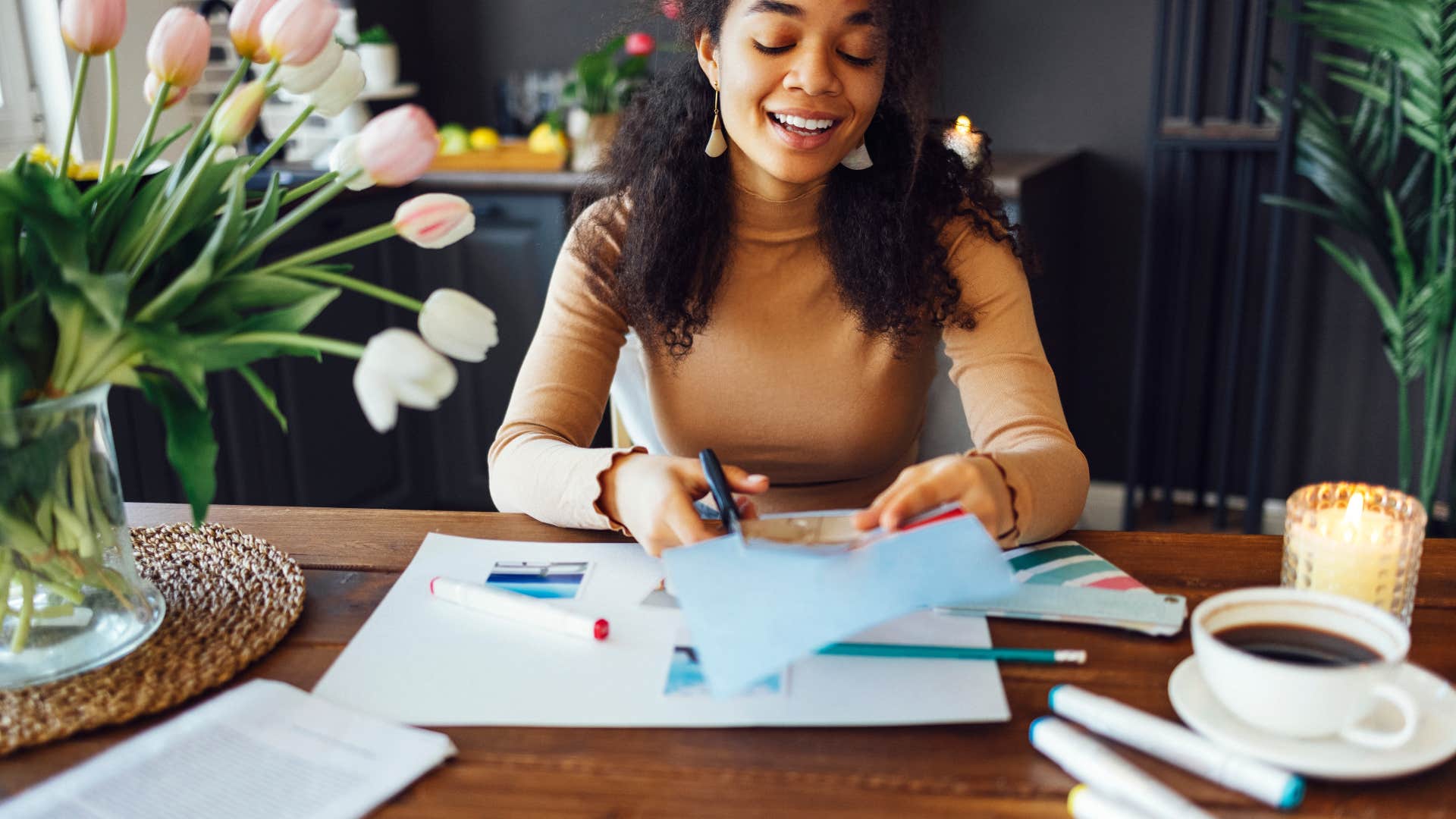 Gen Z woman doing boomer hobby scrapbooking