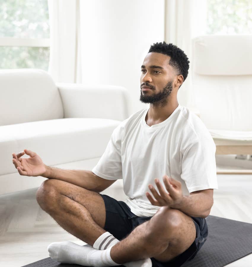 stressed man doing breathwork meditation