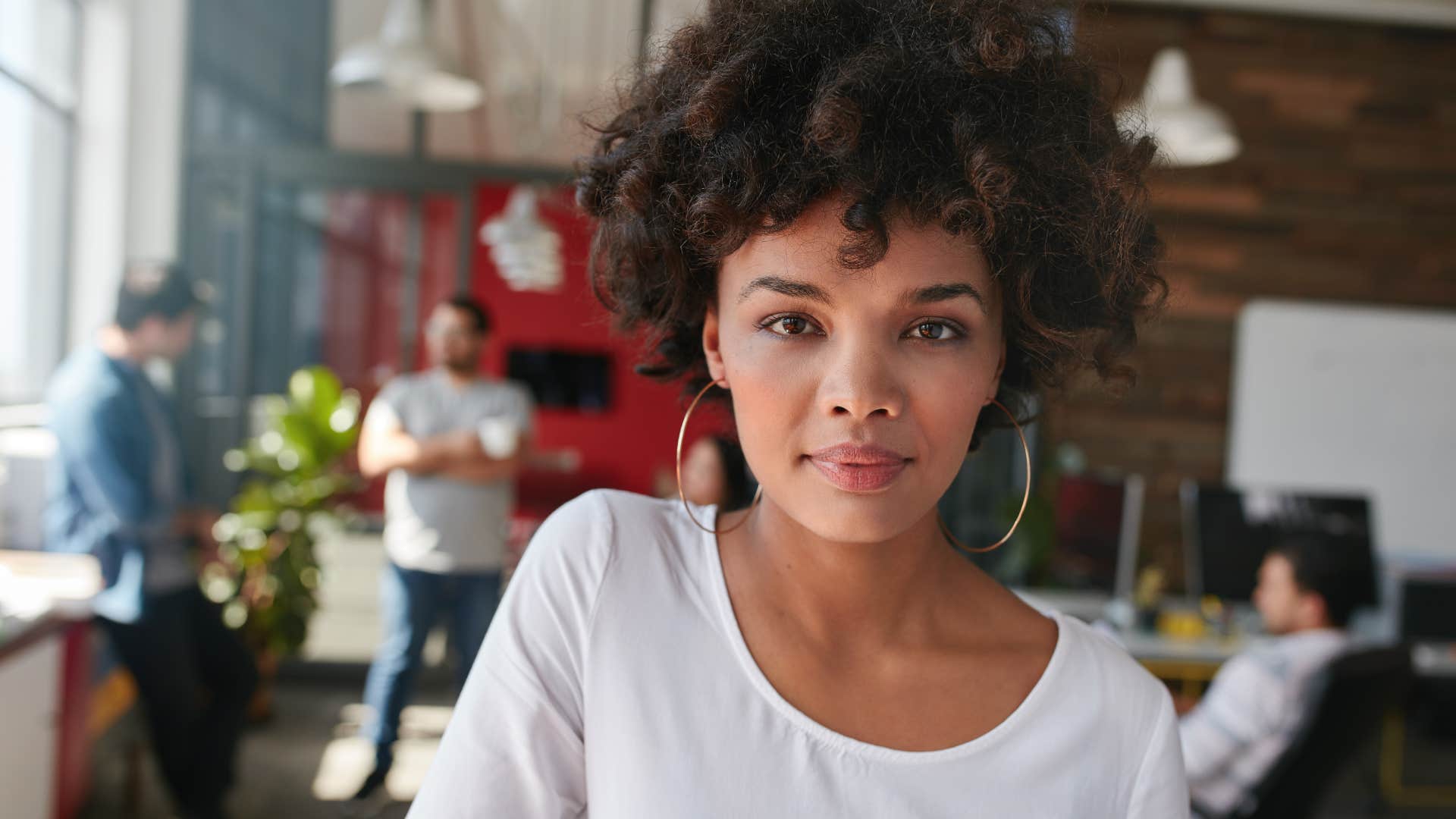 confident young woman looking interested in conversation