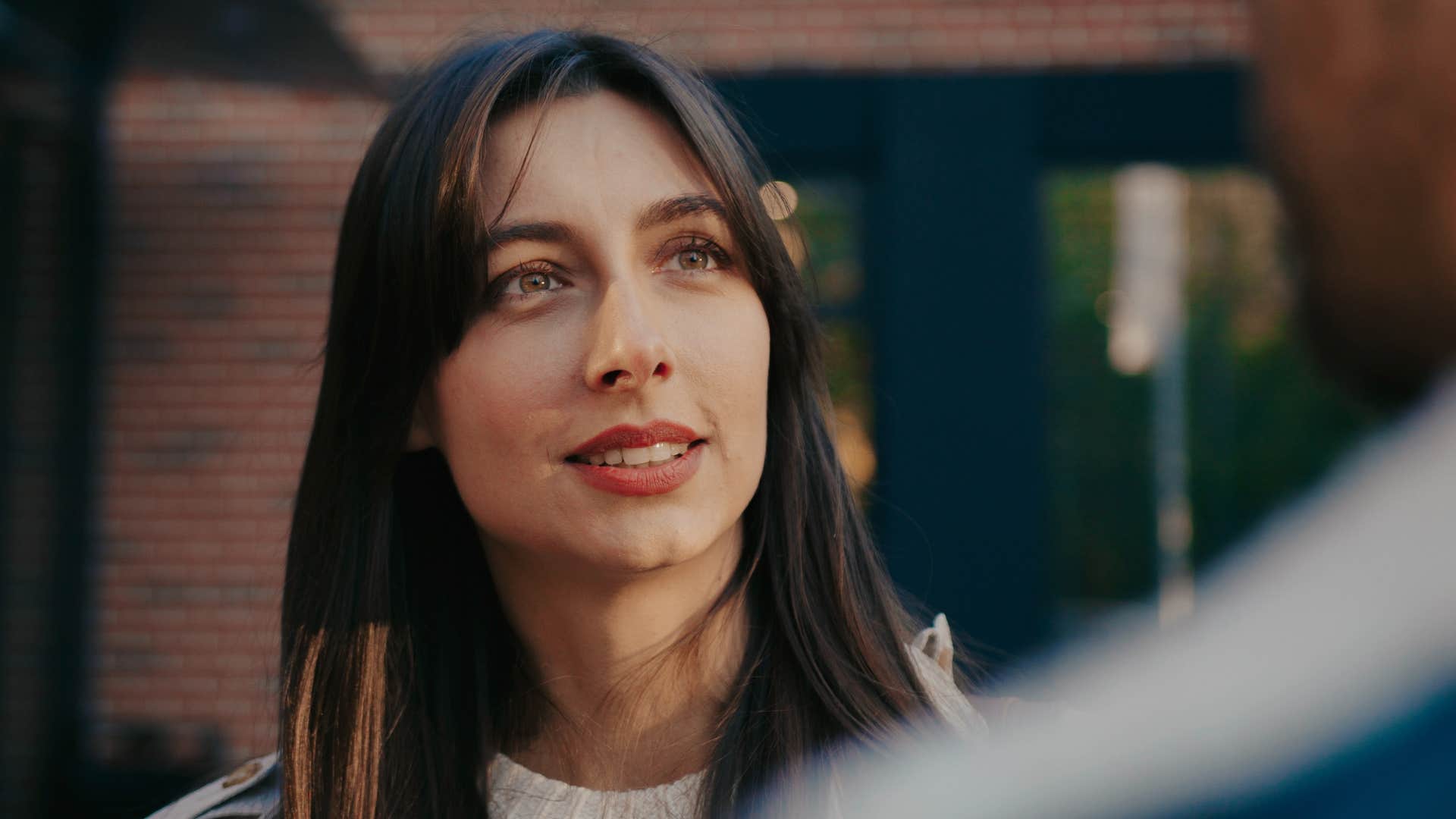 woman smiling asking for help