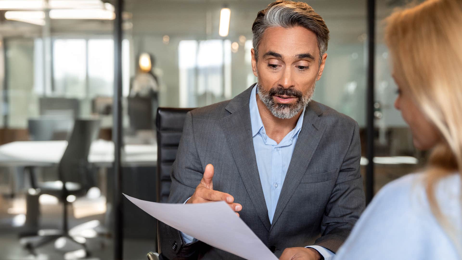 Professional man having a serious conversation with a co-worker