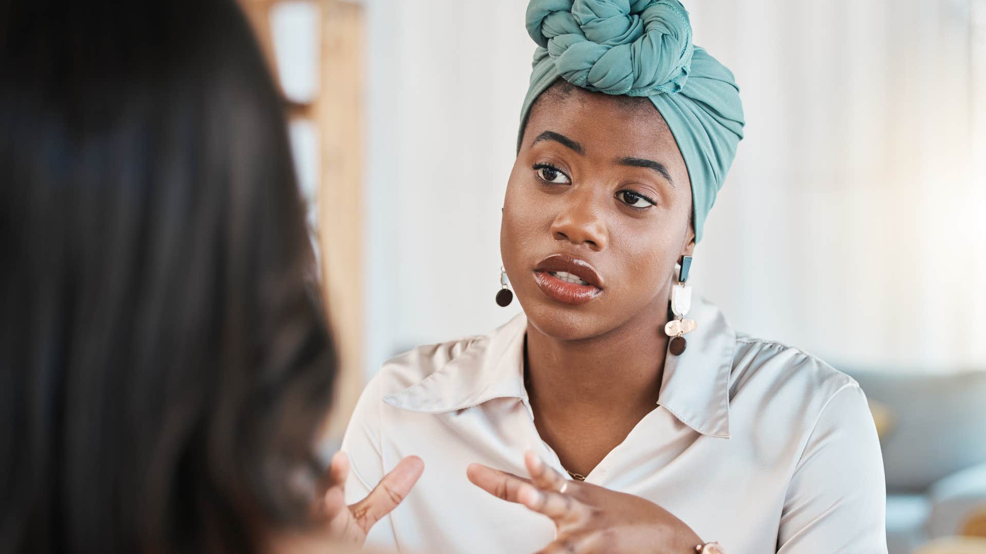 Professional woman having a serious conversation with a peer