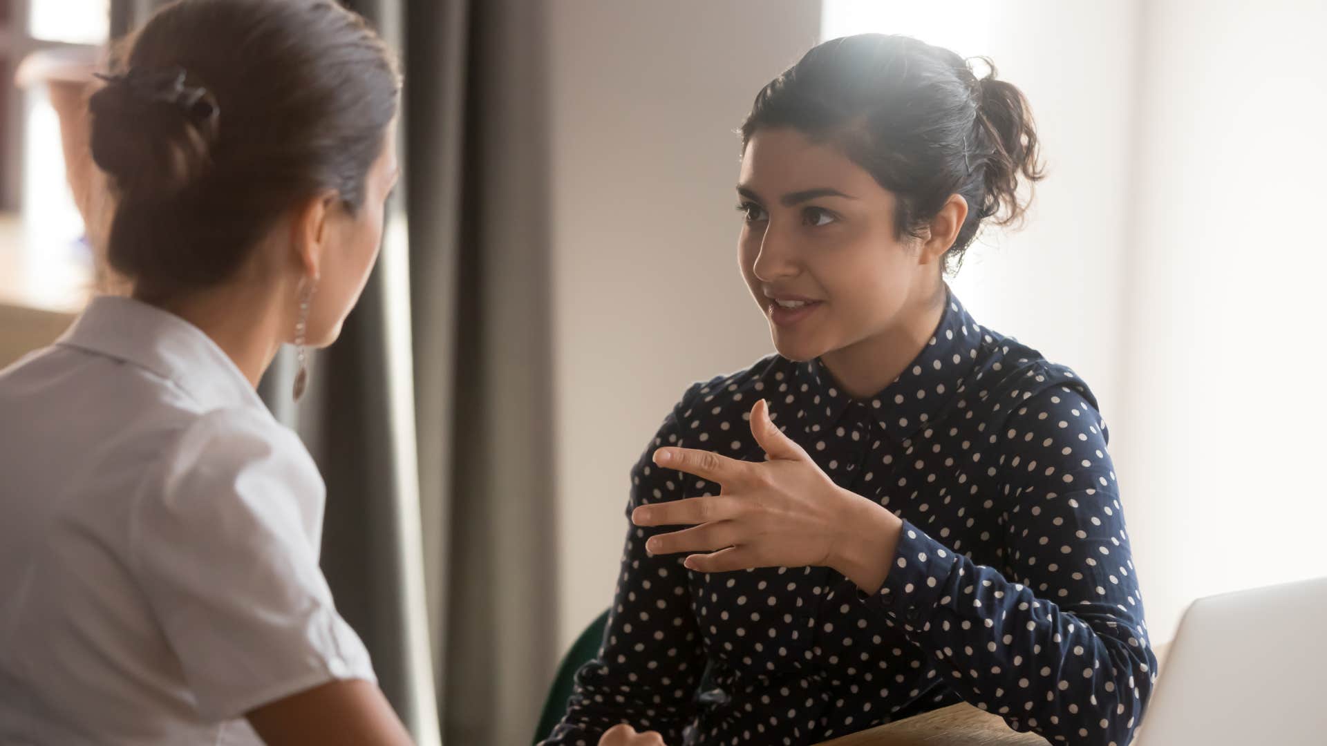 woman talking with colleague about privacy