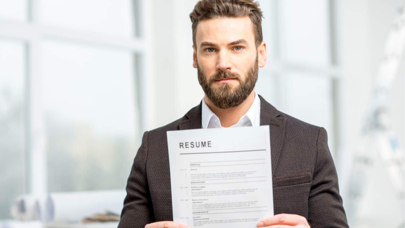 Job applicant holding a copy of his resume