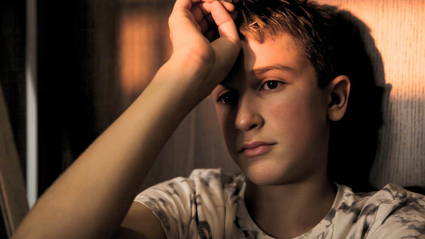 Teenager in bedroom.