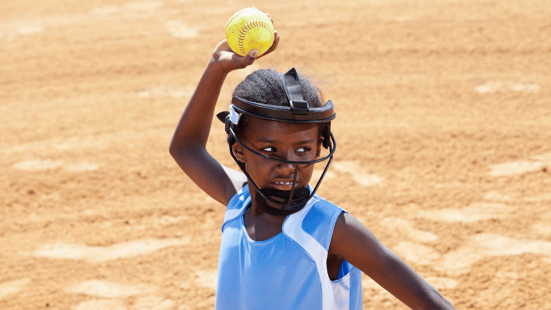 boy throwing a hard ball