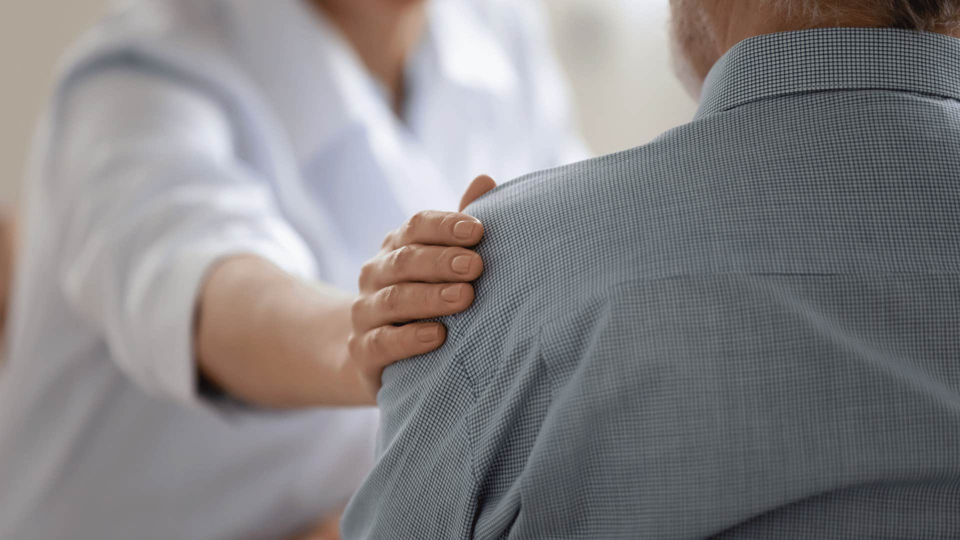 woman comforting man