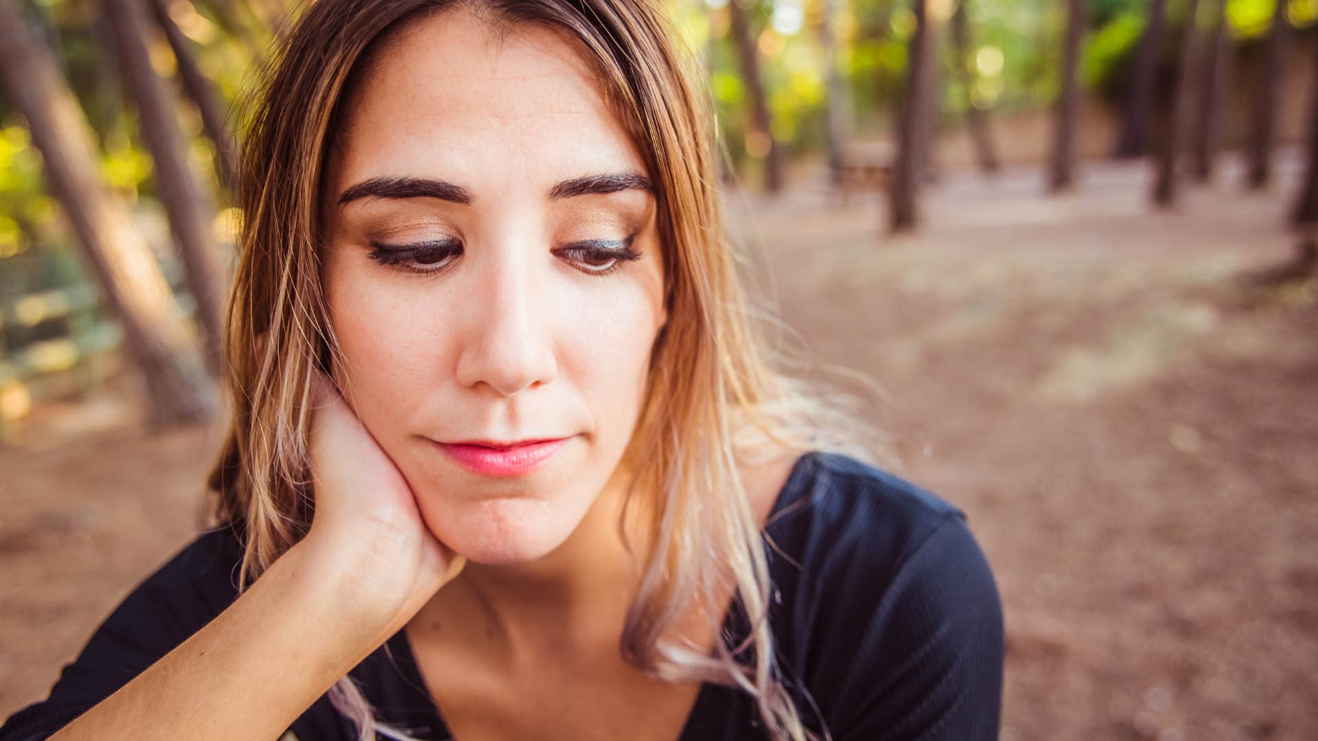 Portrait of young woman studying with thoughtful appearance