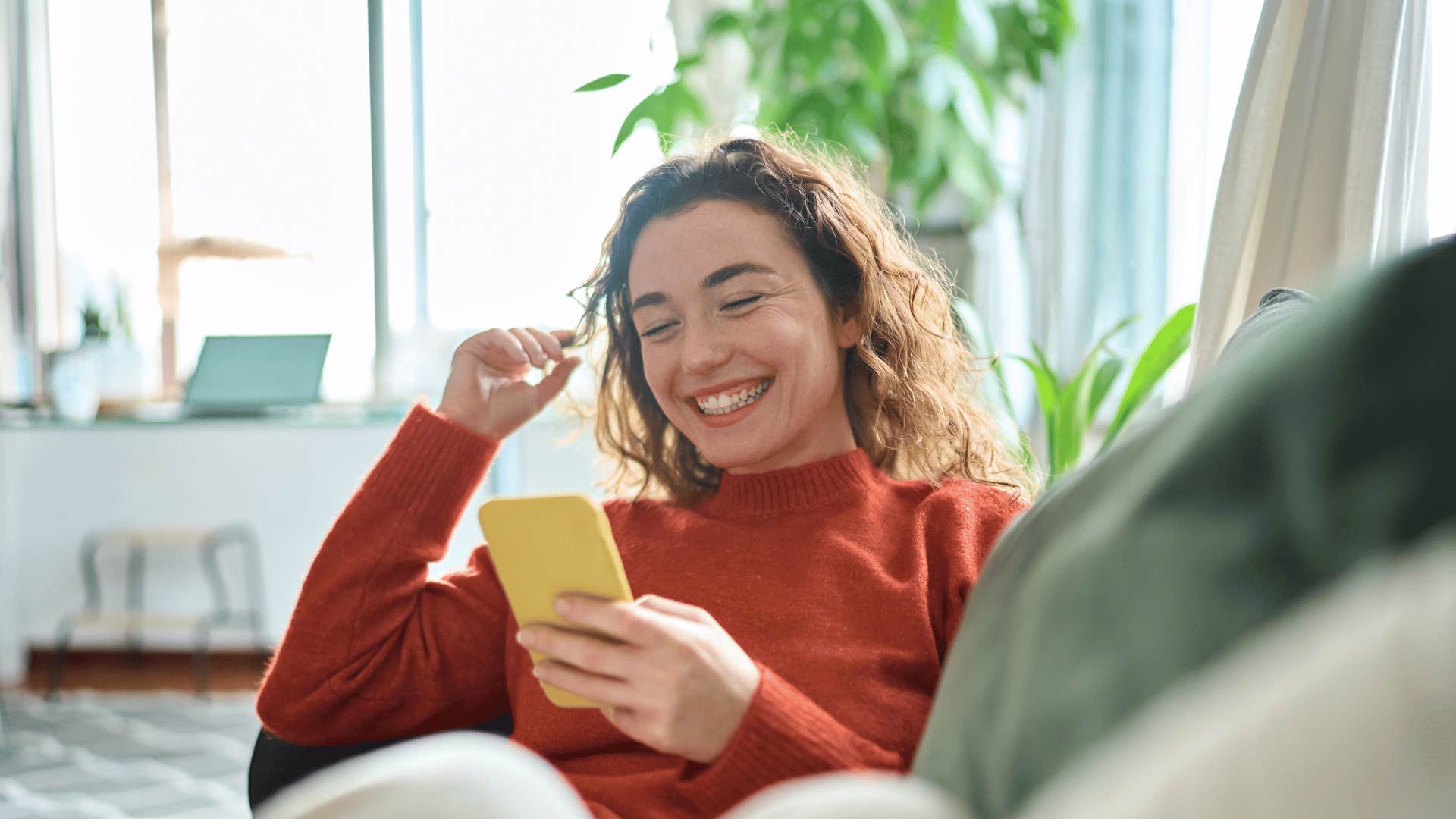 woman smiling on phone