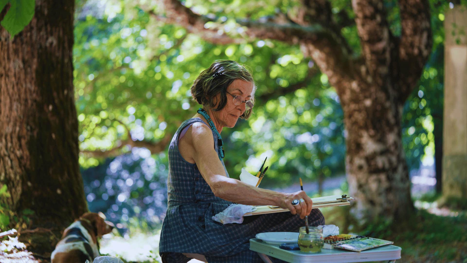 boomer woman painting outside