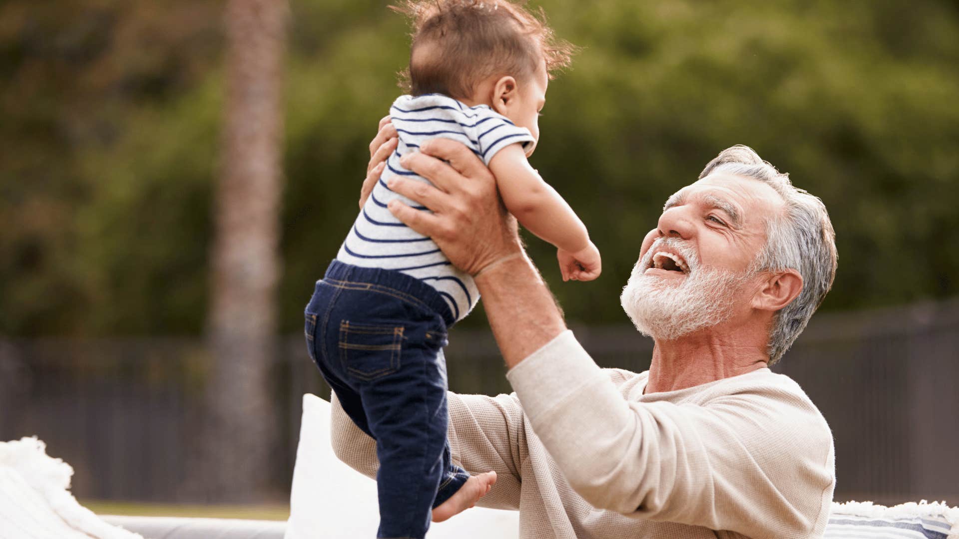 boomer grandpa helping raise grandson