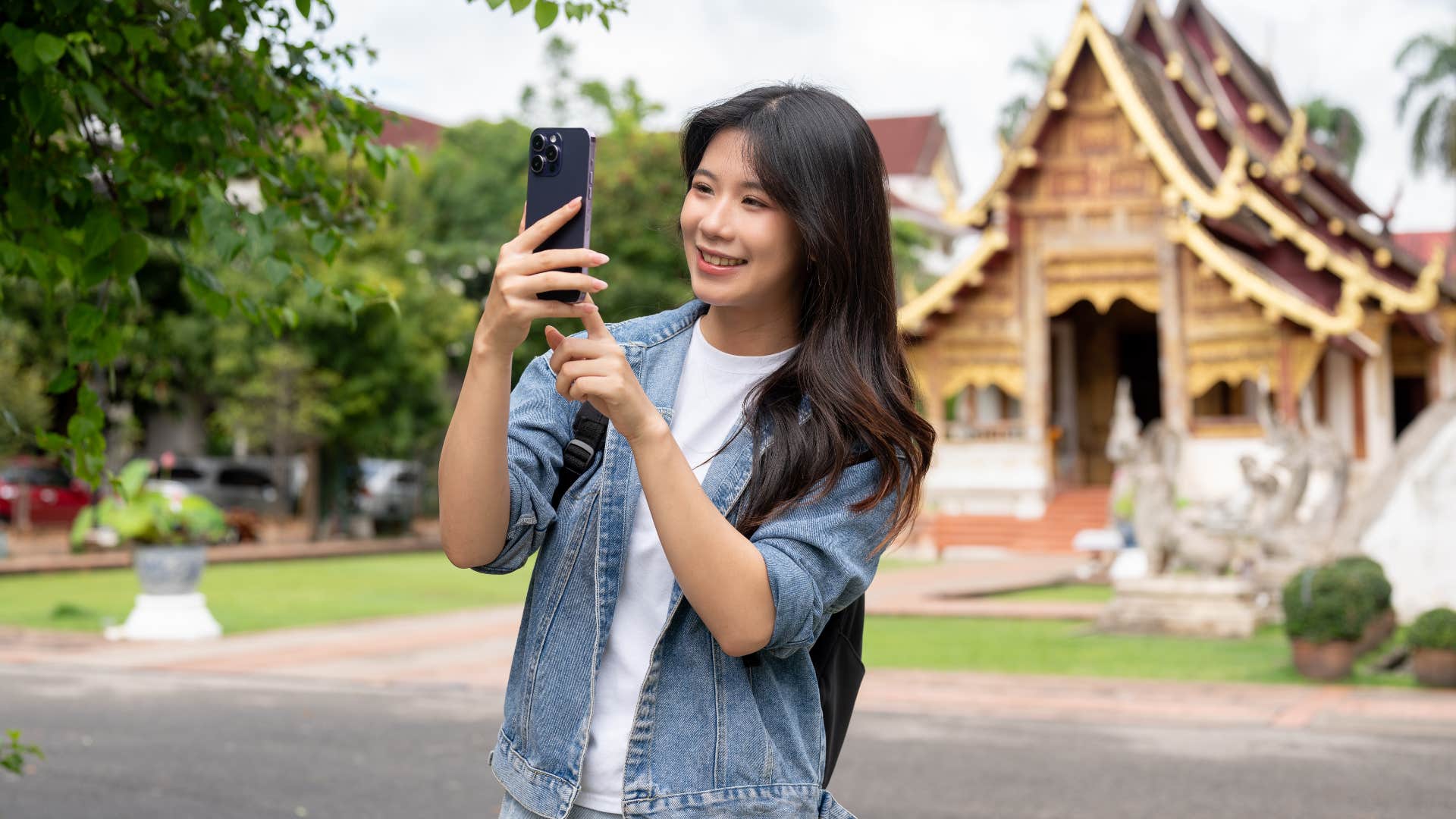 Woman filming a video on her phone