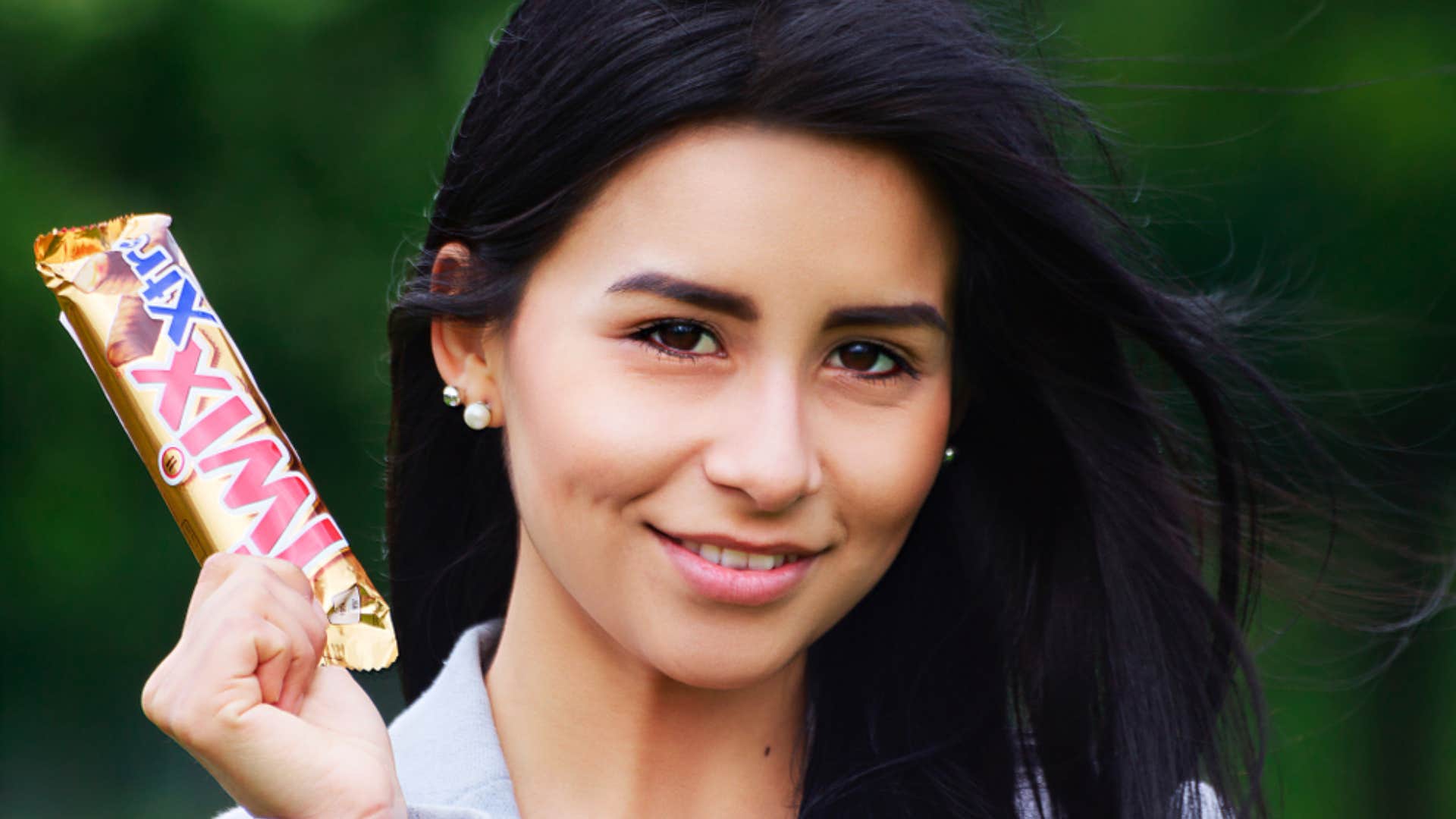 woman with brand name candy bar 