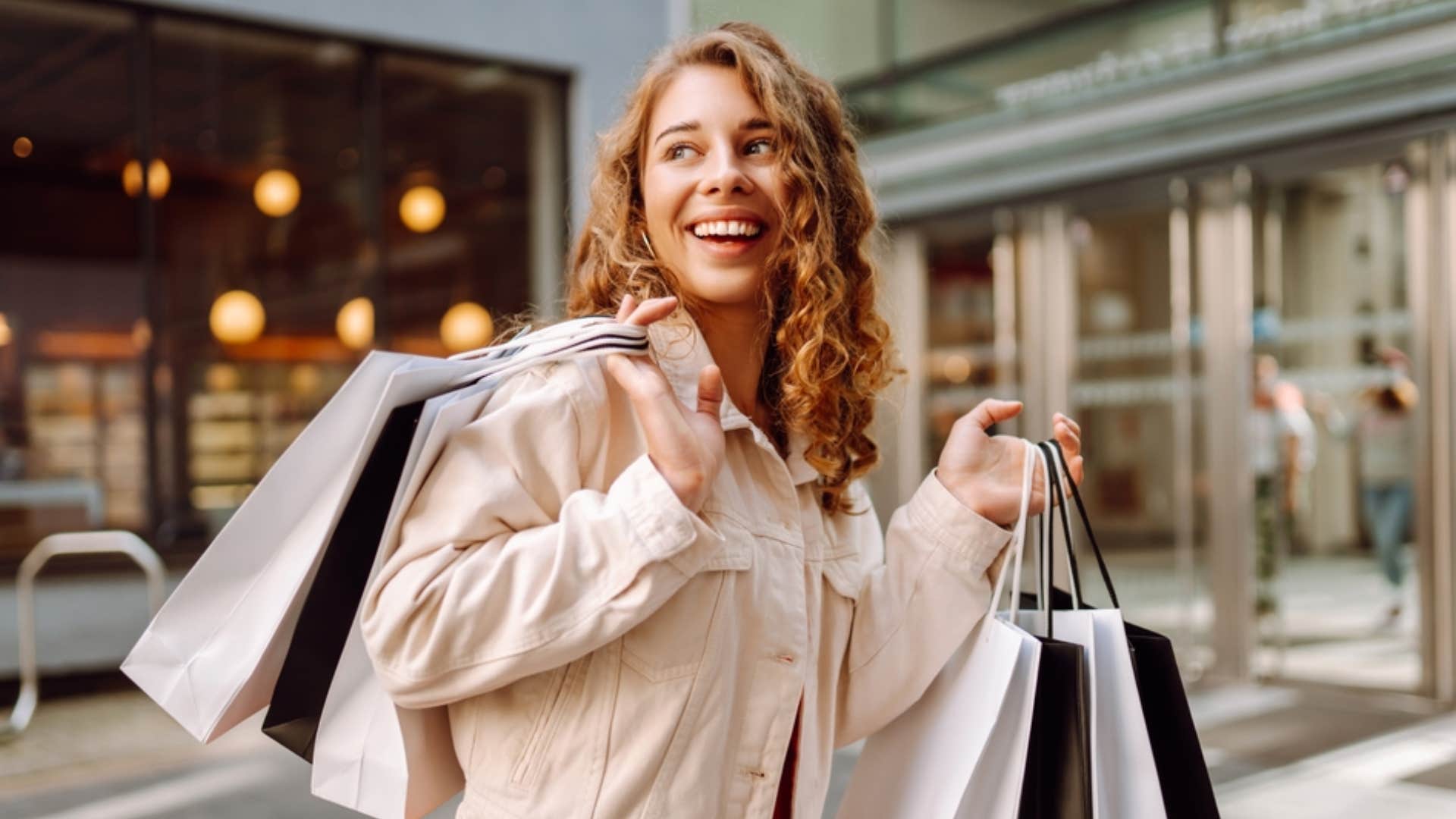 woman holding bags from shopping