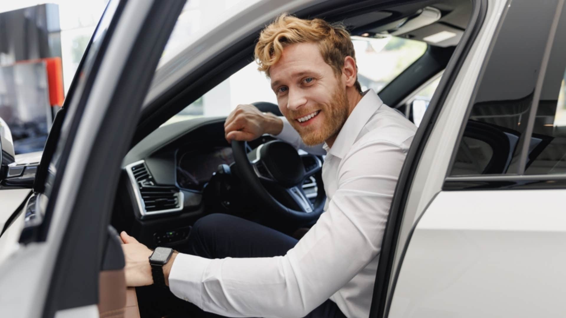 man buying new car 