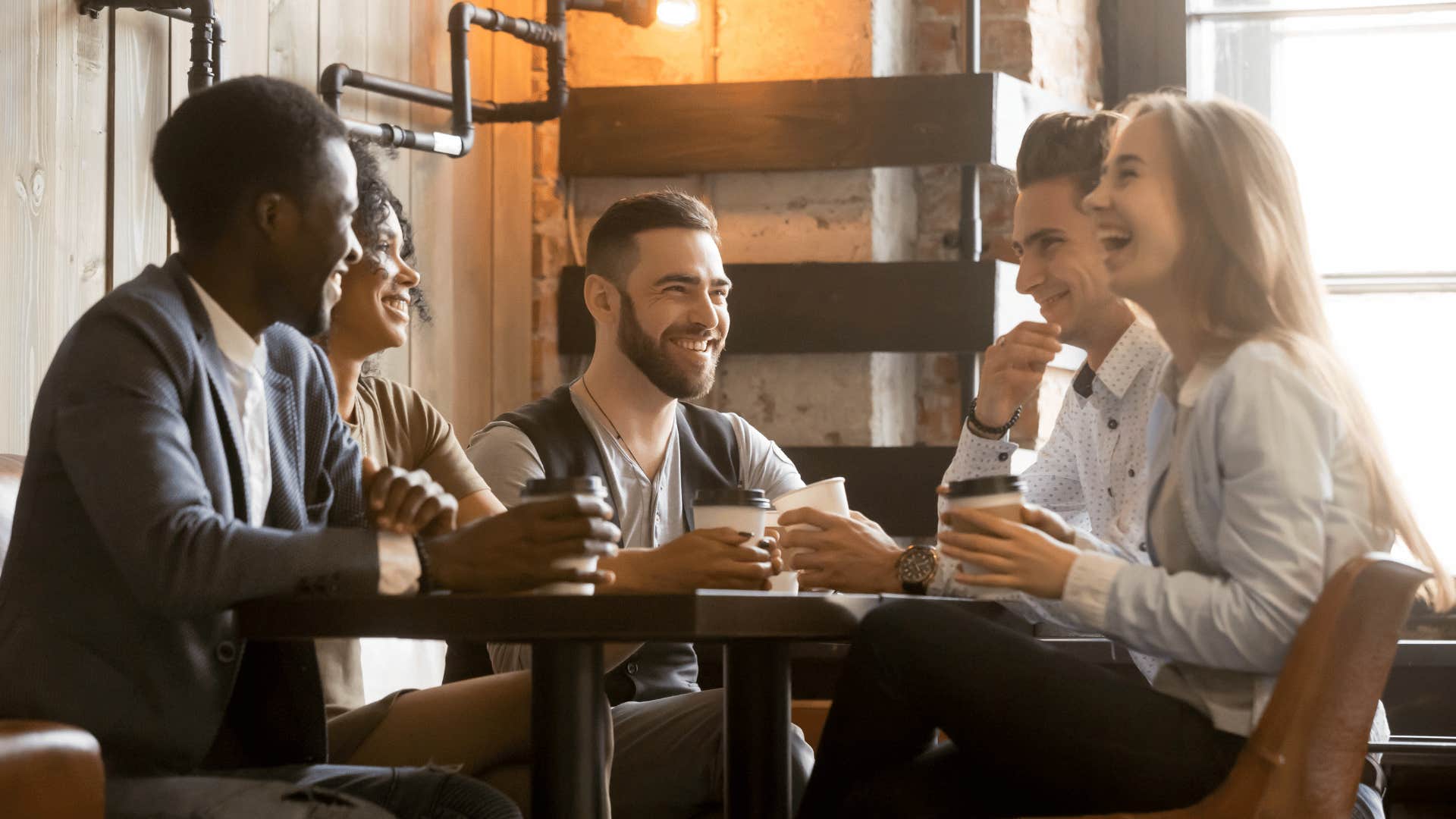 group of friends sitting at a table