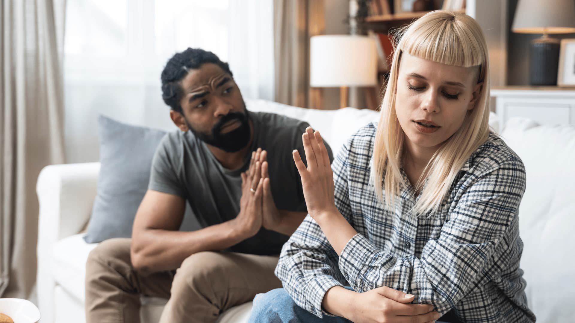 woman ignoring pleading partner