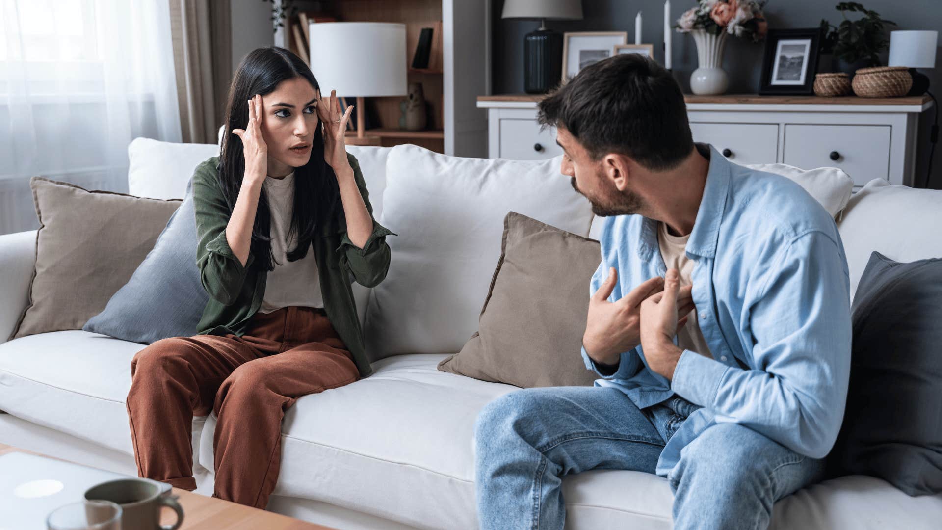 couple arguing on couch