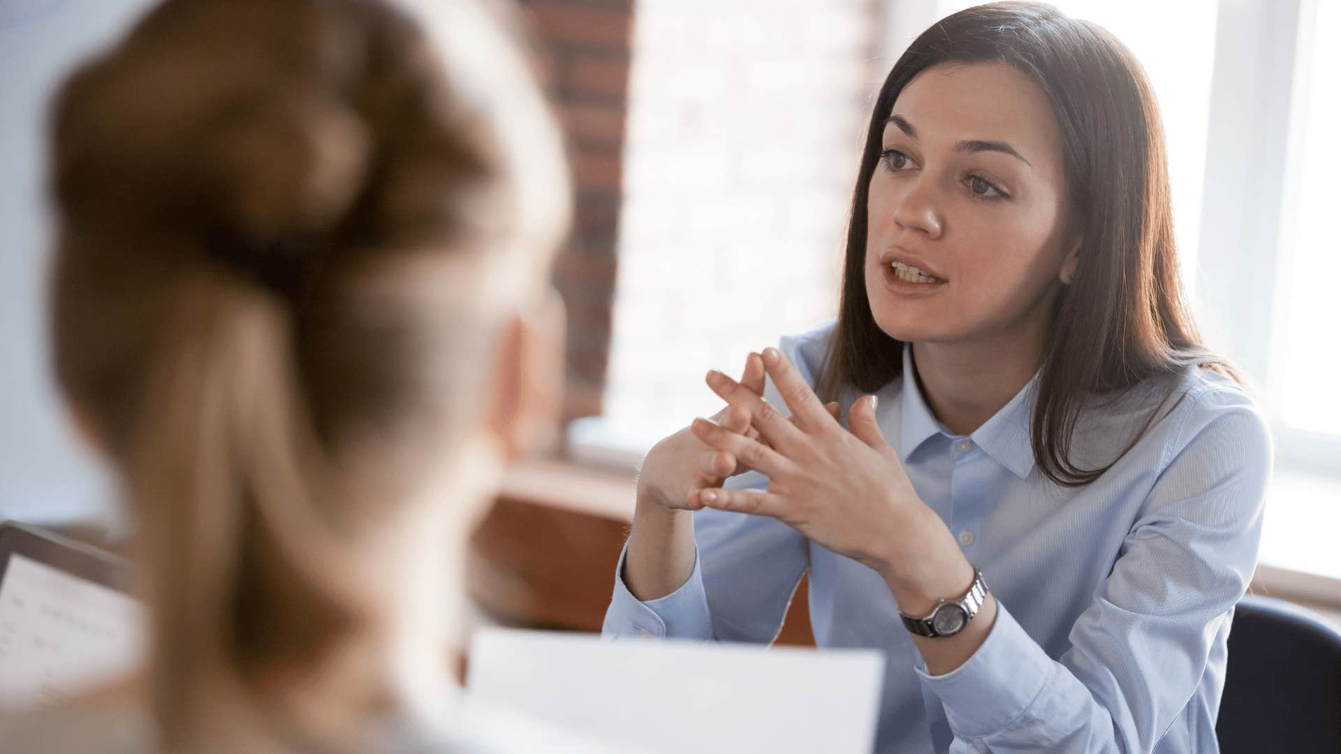 woman sternly talking