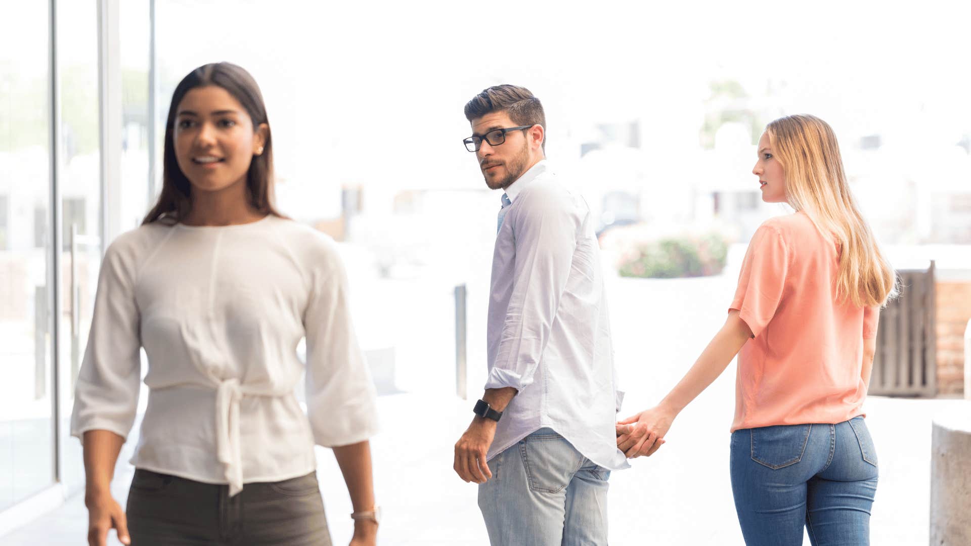 man checking out other woman