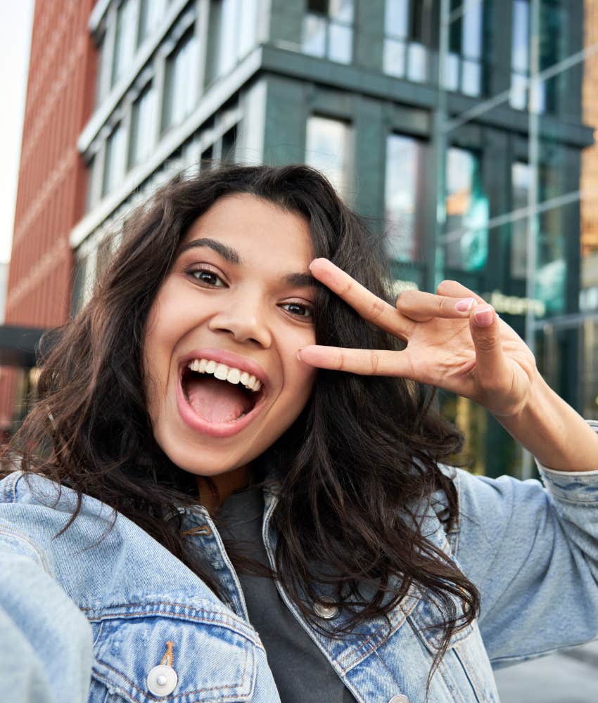 Confident woman taking selfie popular because she can handle any situation 