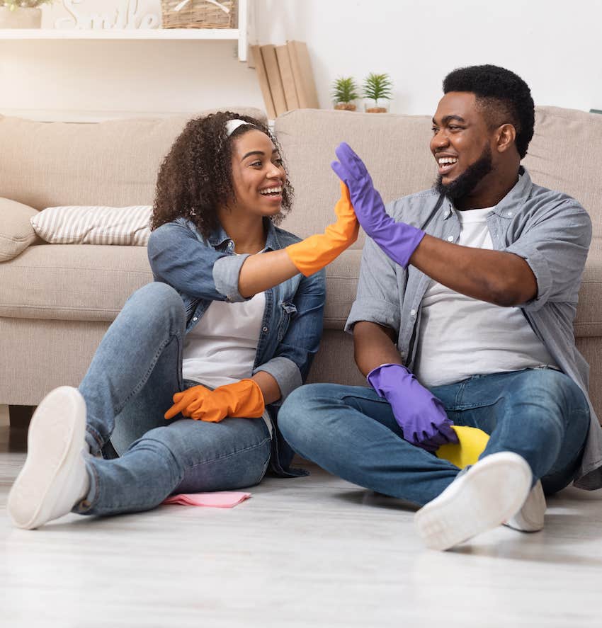 Couple high fives after cleaning house