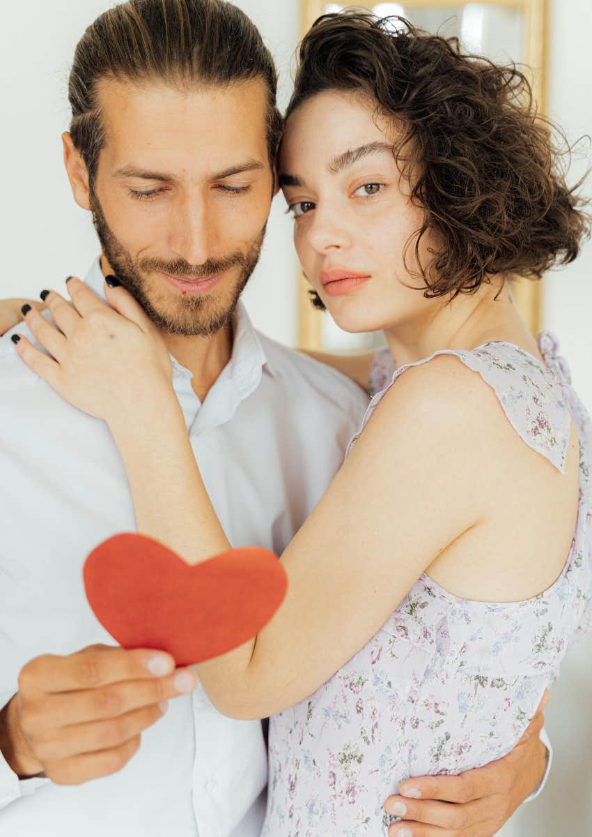 couple looking at Valentine's Day card from girlfriend's dad