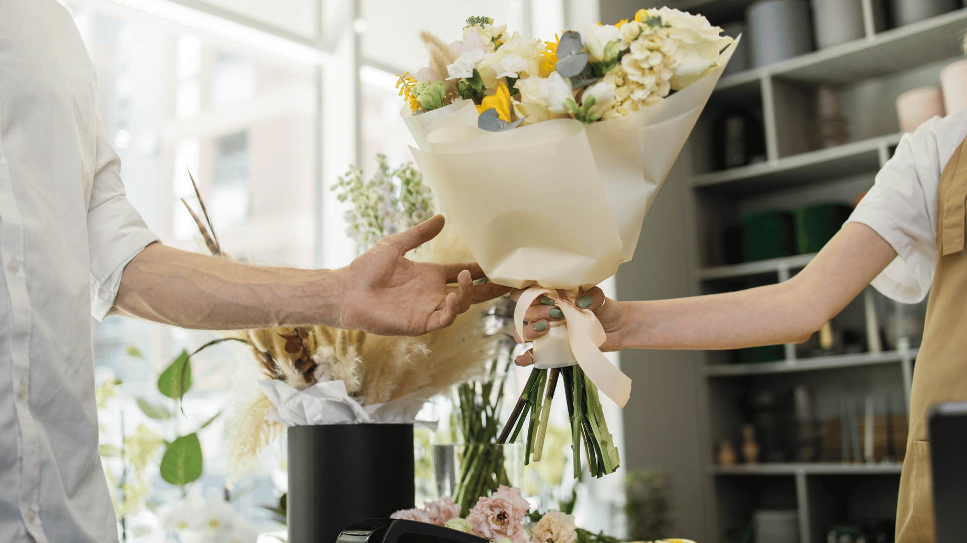 man buying flowers