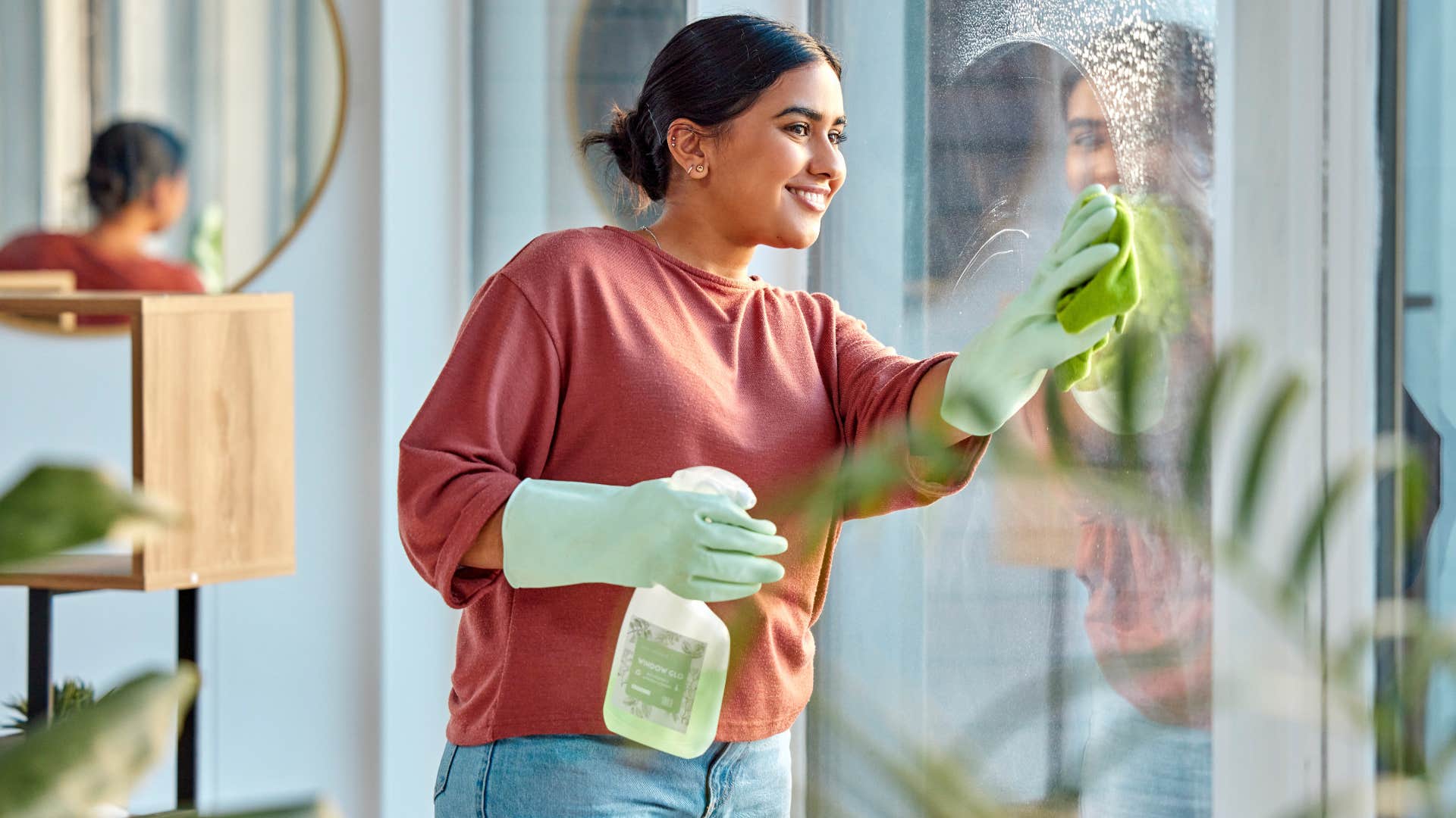 Woman who knows the critical fact never to mix cleaning solutions