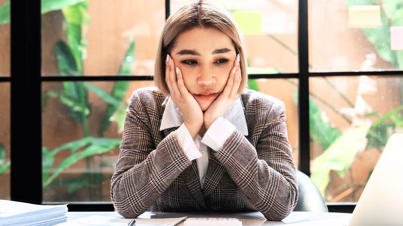 Miserable working woman debating on leaving job. 