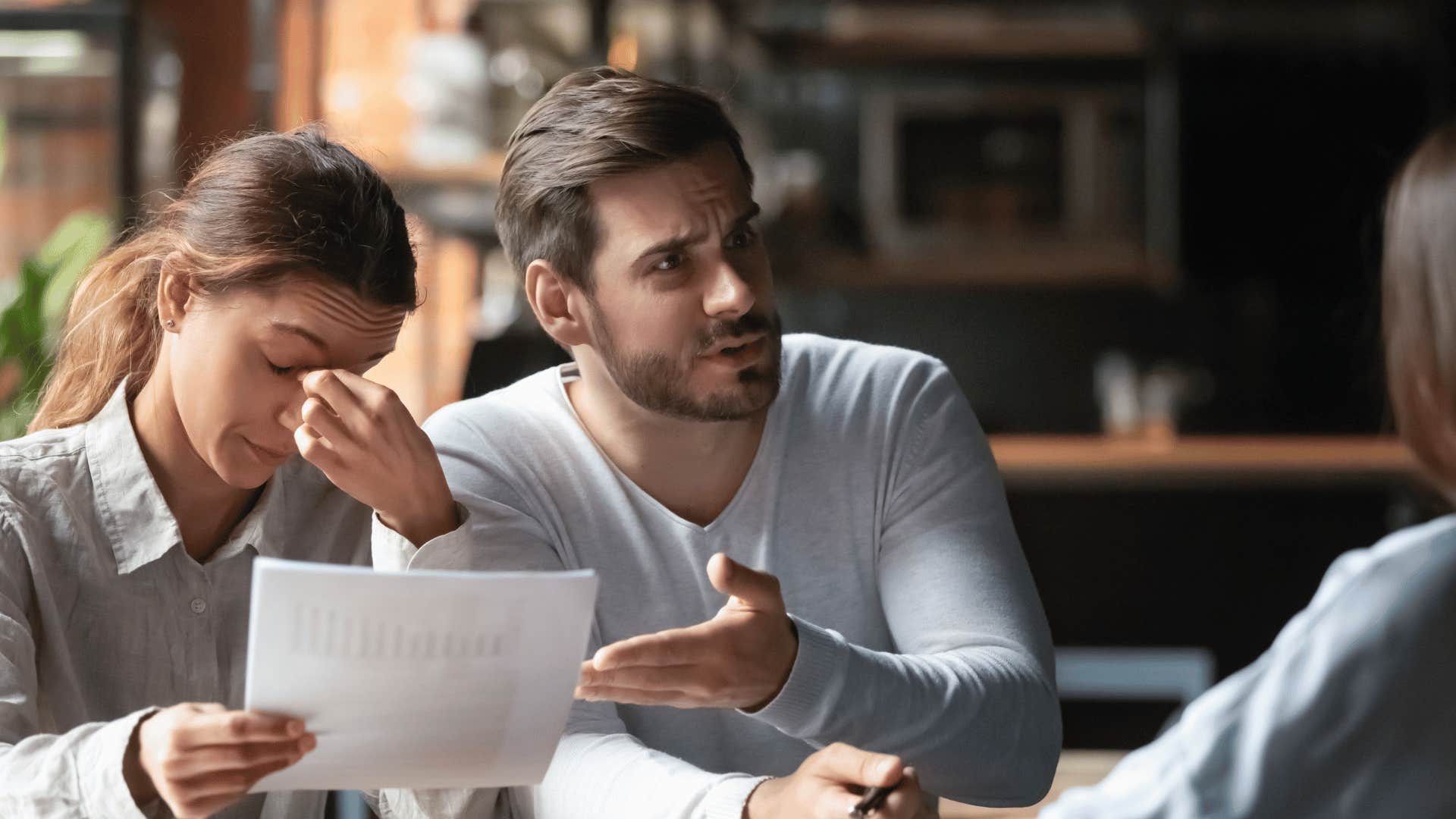 upset man and woman with contract