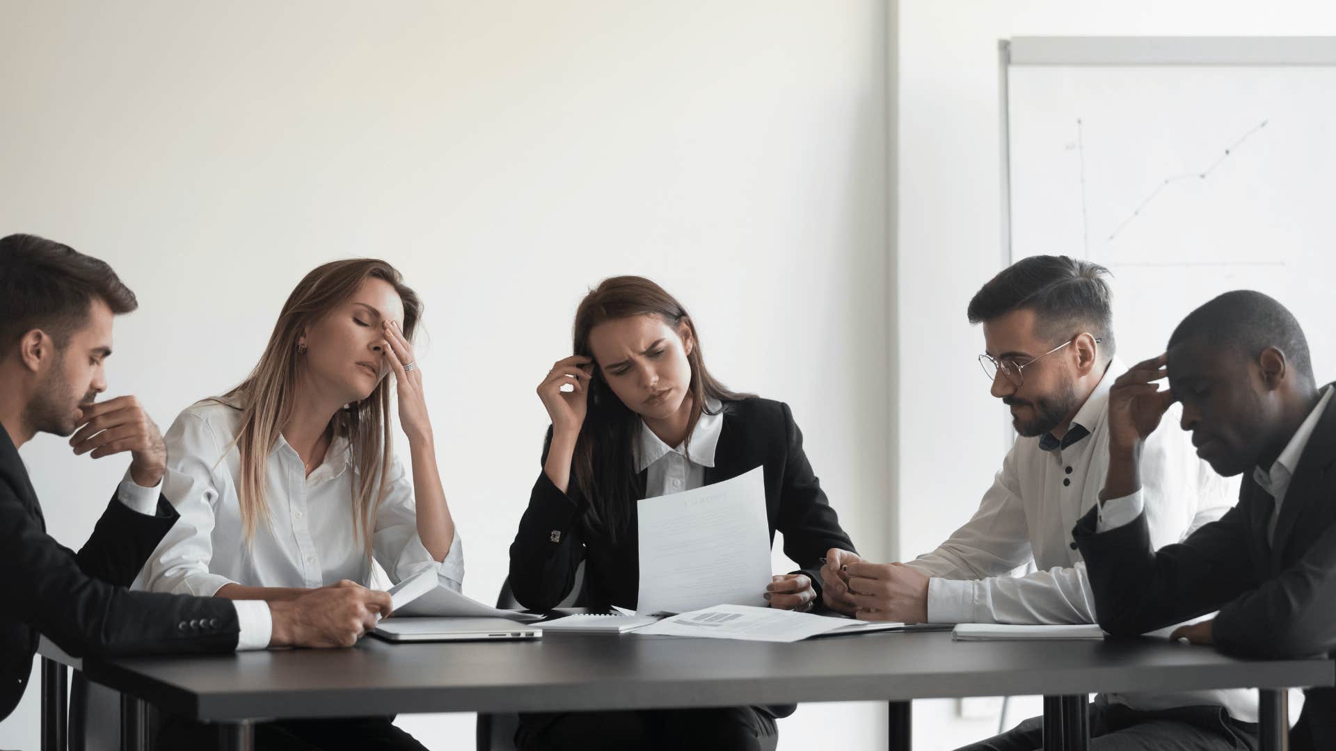 tired people in work meeting