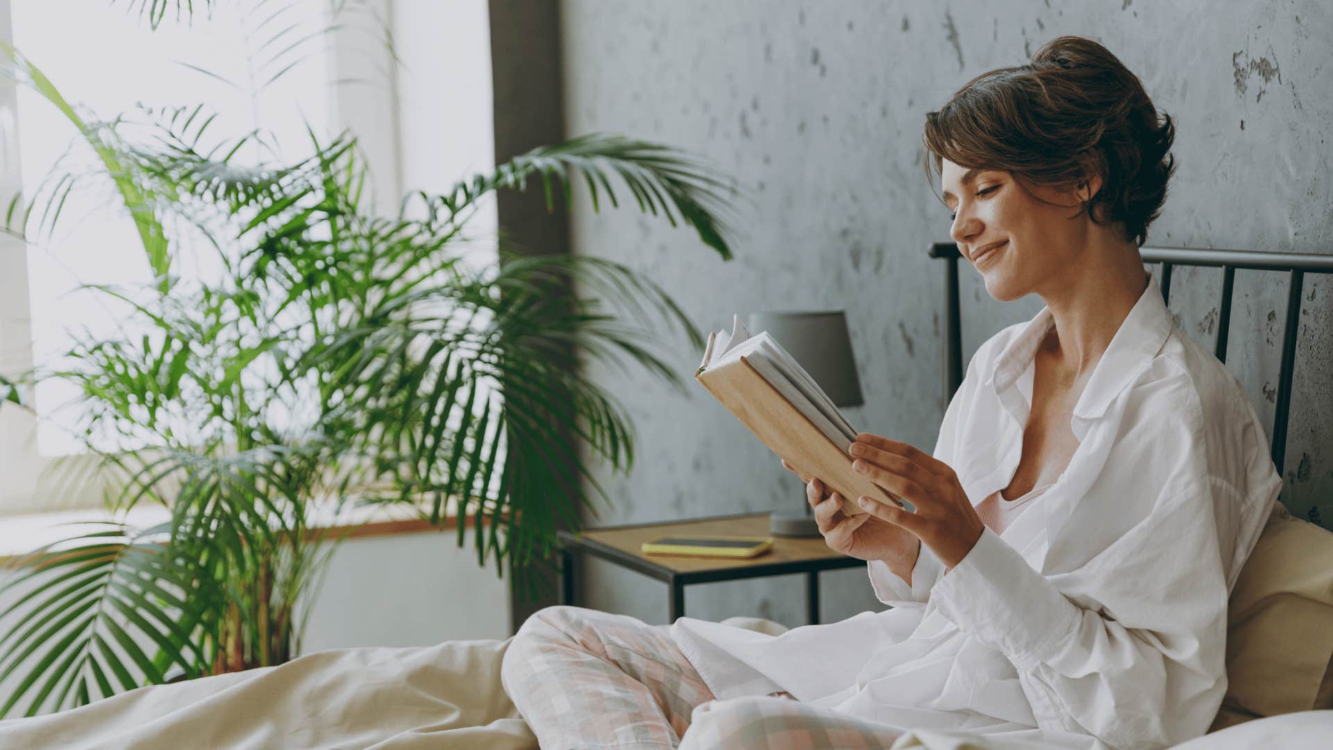 woman reading in bed