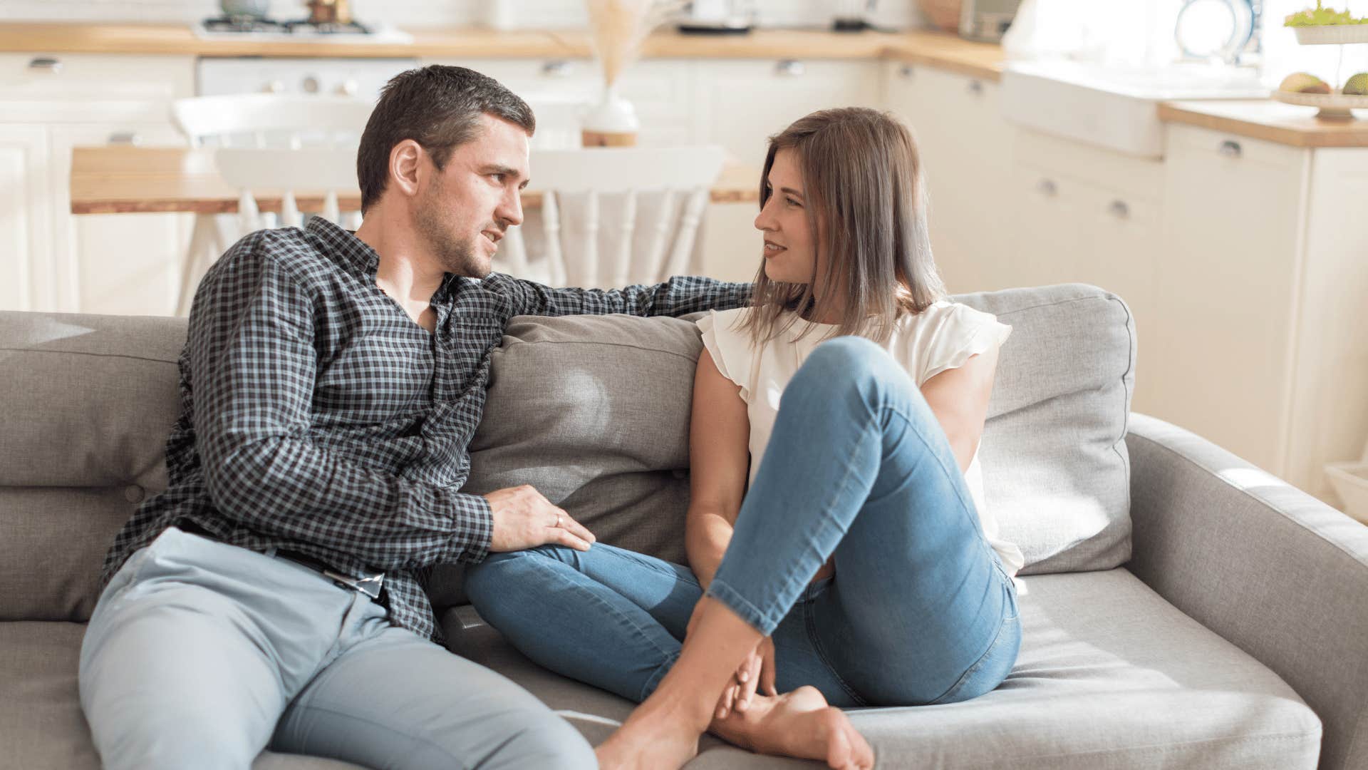 couple talking on couch