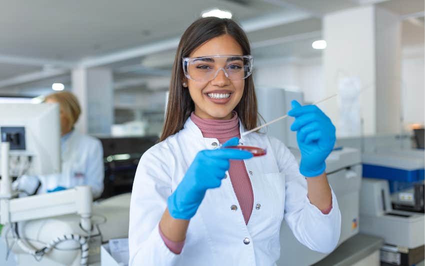 Woman in a bio-lab showing the competitiveness of work in STEM.