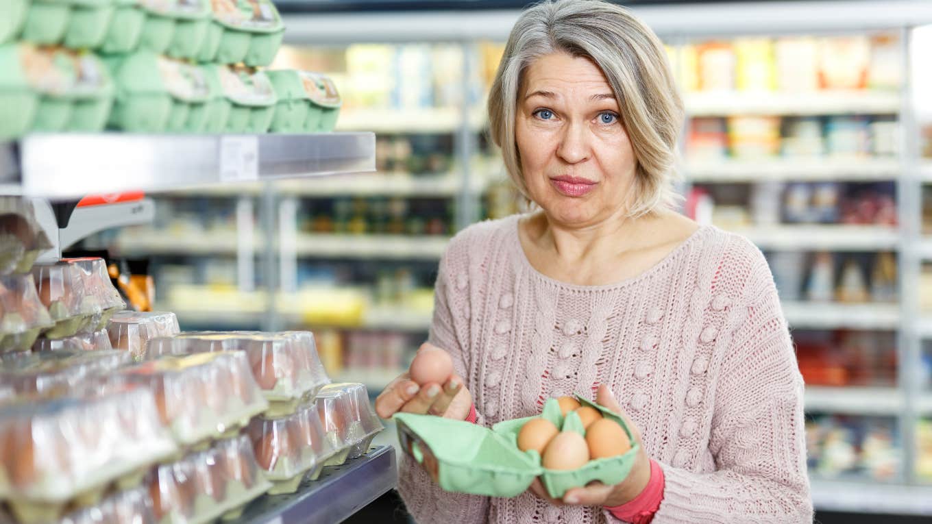 Woman annoyed that eggs are so expensive